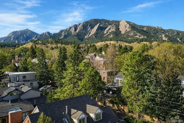 an aerial view of houses with yard