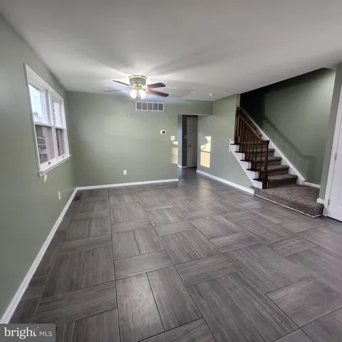 an empty room with wooden floor