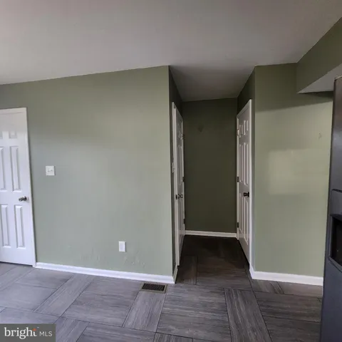 wooden floor and closet in a en suite bathroom