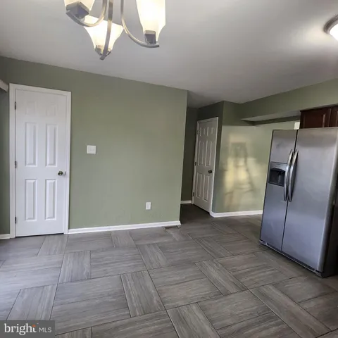 a view of a livingroom with a kitchen