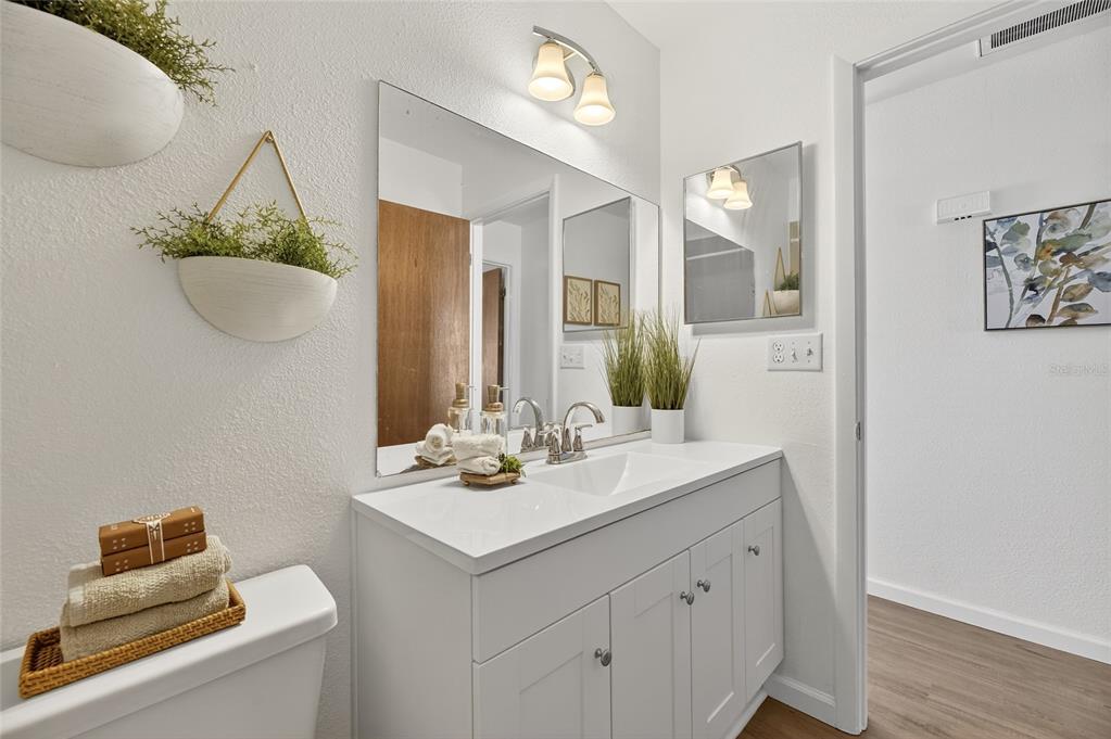 13035 Santee Street Spring Hill, FL 34609 - Photo 27 of 39 a bathroom with a sink and a mirror