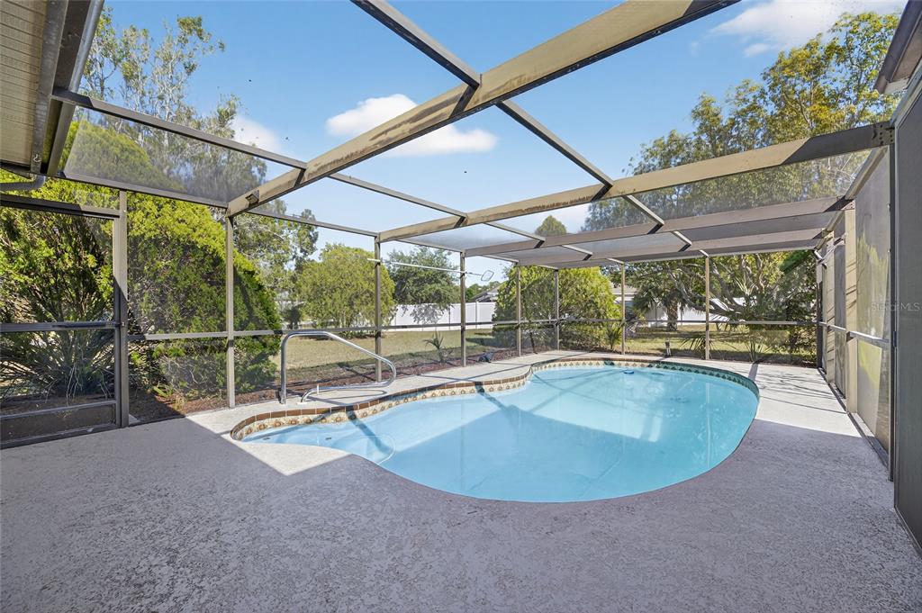 13035 Santee Street Spring Hill, FL 34609 - Photo 29 of 39 a view of a swimming pool with a patio