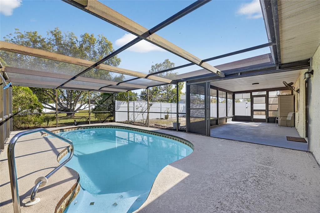 13035 Santee Street Spring Hill, FL 34609 - Photo 30 of 39 a view of swimming pool with outdoor seating