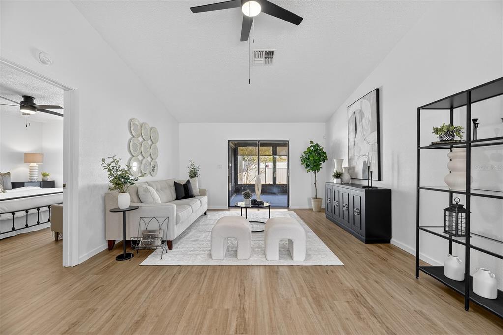 13035 Santee Street Spring Hill, FL 34609 - Photo 7 of 39 a living room with furniture and wooden floor