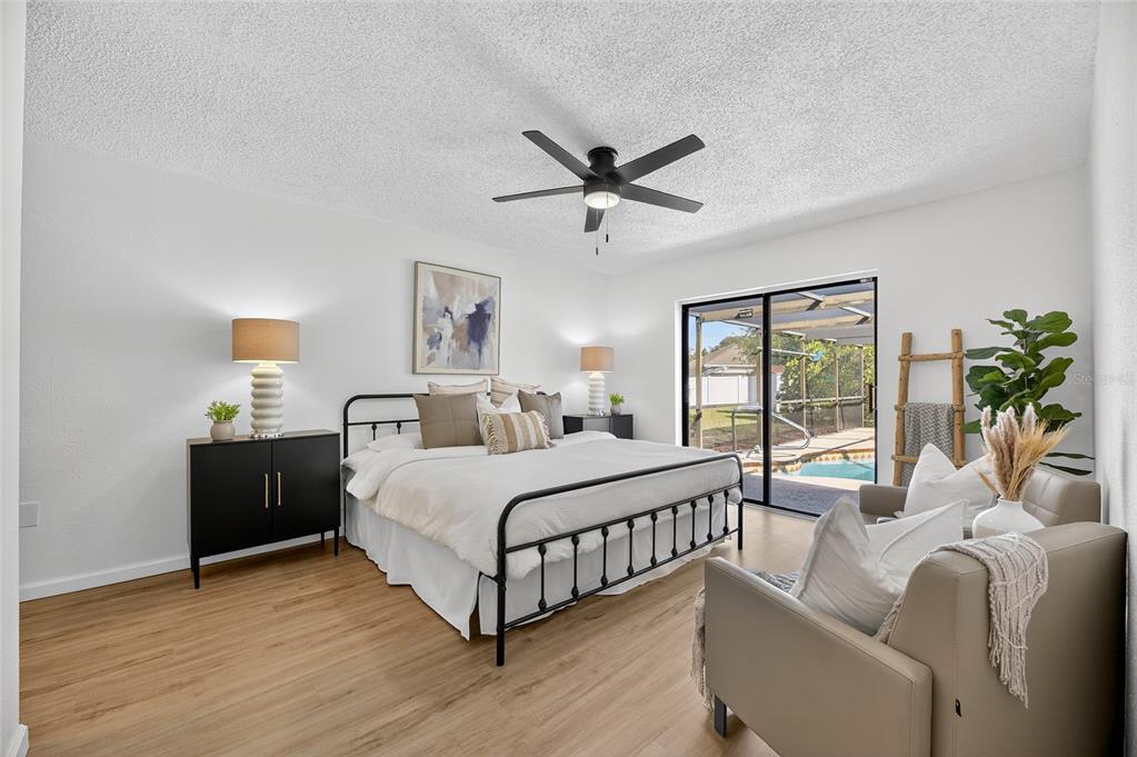 13035 Santee Street Spring Hill, FL 34609 - Photo 8 of 39 a bed room with a bed and a window