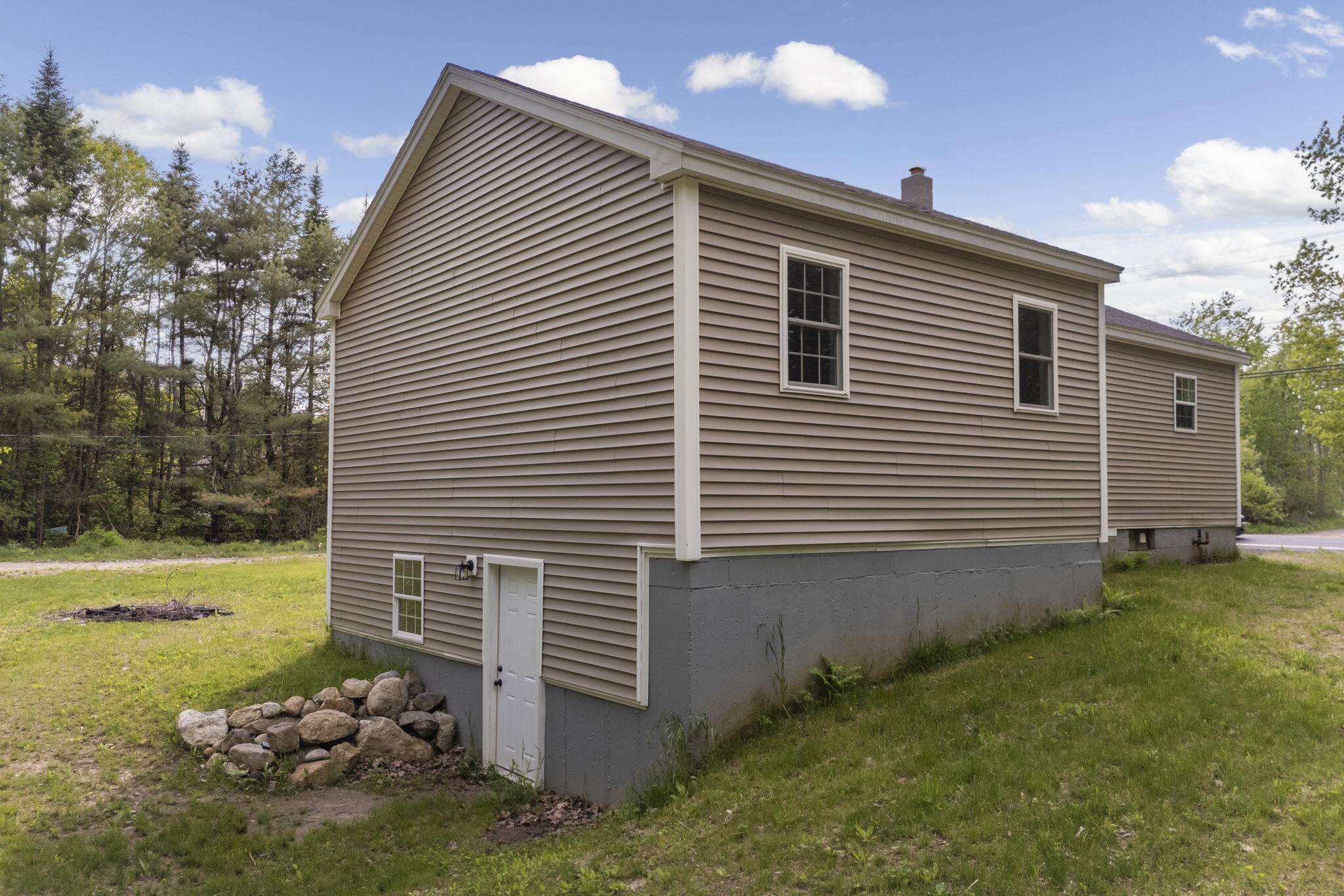 693 Pond Road Wales, ME 04280 - Photo 33 of 41 Walkout access/rear exterior