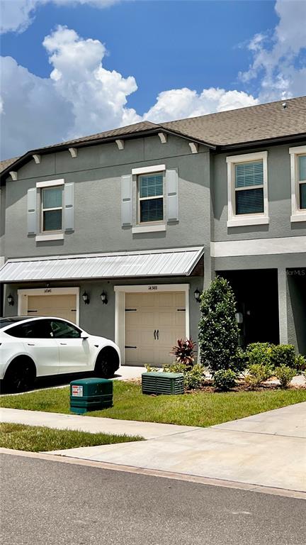 14348 Editors Note Street Ruskin, FL 33573 - Photo 29 of 29 a front view of a house with a yard
