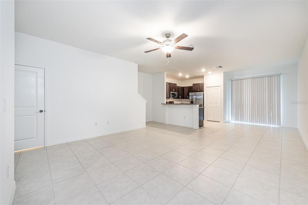 14348 Editors Note Street Ruskin, FL 33573 - Photo 8 of 29 a view of a kitchen with a sink and a chandelier fan