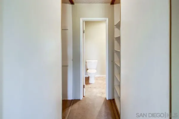 a view of balcony with a floor to ceiling window and wooden floor