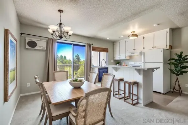 a view of a dining room with furniture window and outside view