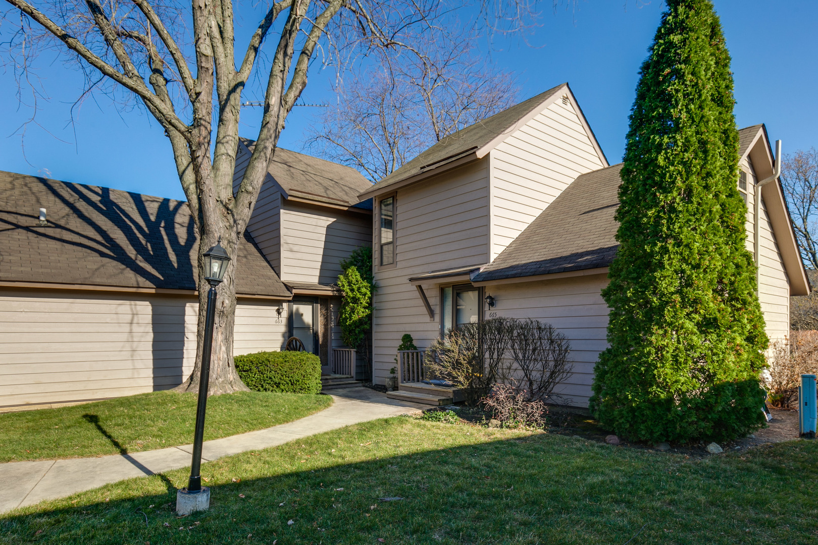 663 Beth Court Gurnee, IL 60031 - Photo 2 of 26 a view of a house with a yard and potted plants