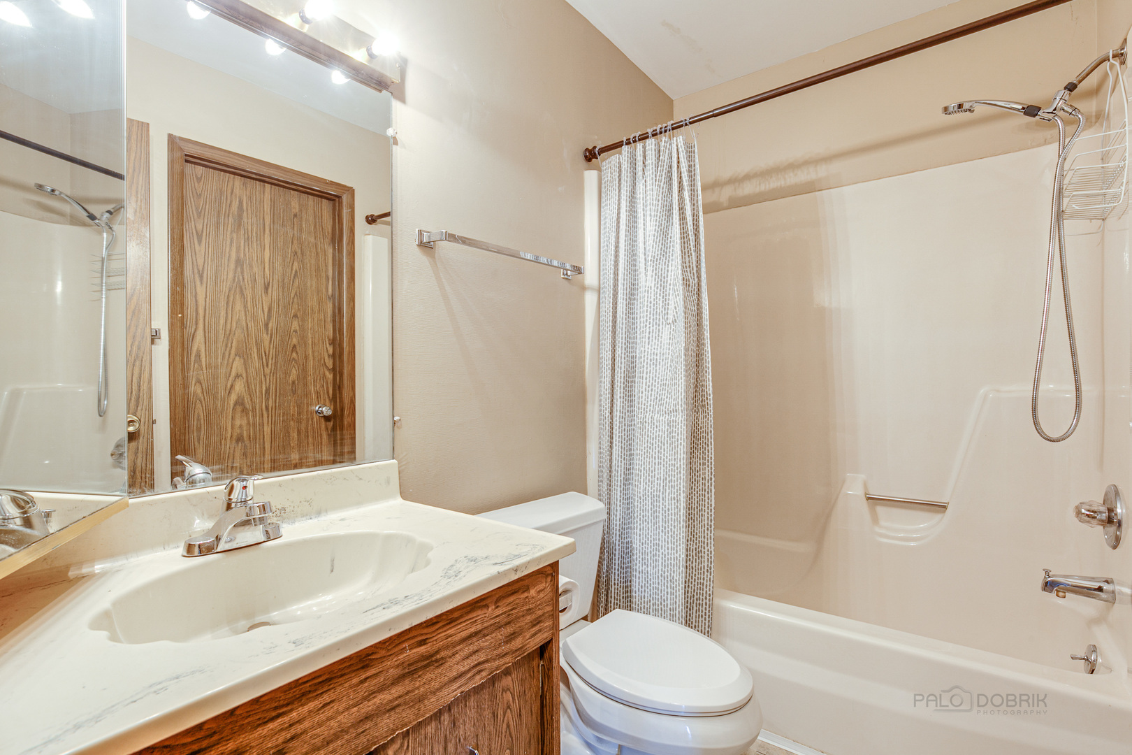 663 Beth Court Gurnee, IL 60031 - Photo 12 of 26 a bathroom with a granite countertop sink toilet and shower