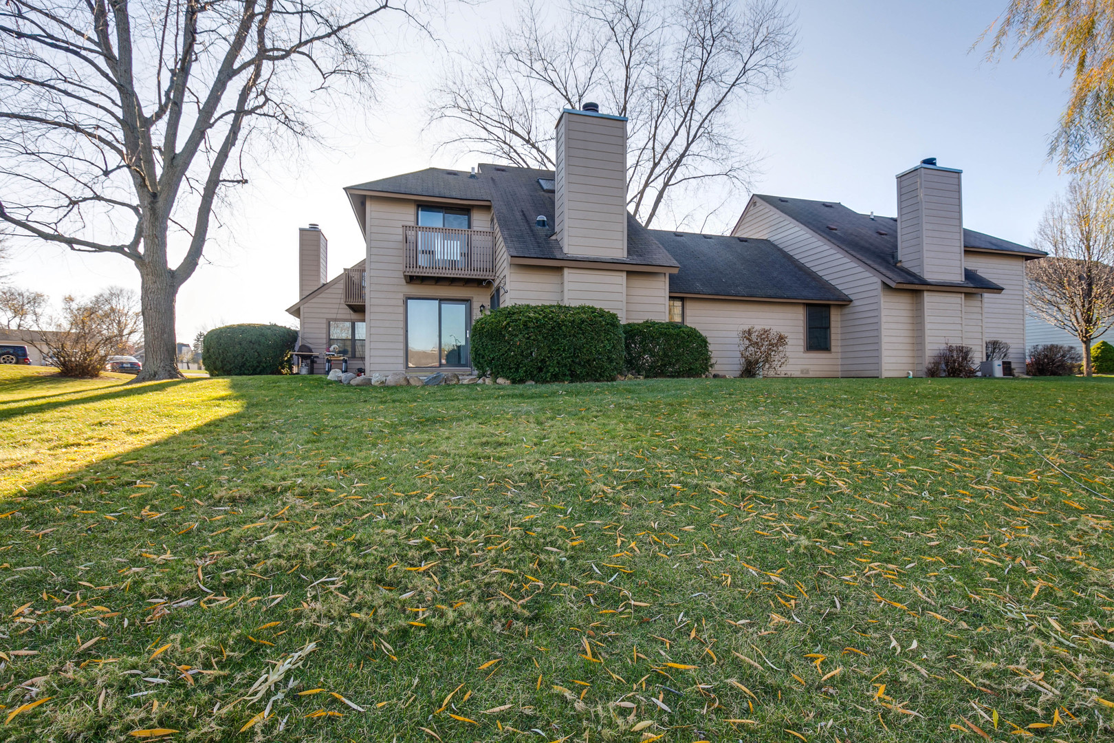 663 Beth Court Gurnee, IL 60031 - Photo 23 of 26 a view of a house with a big yard and large trees