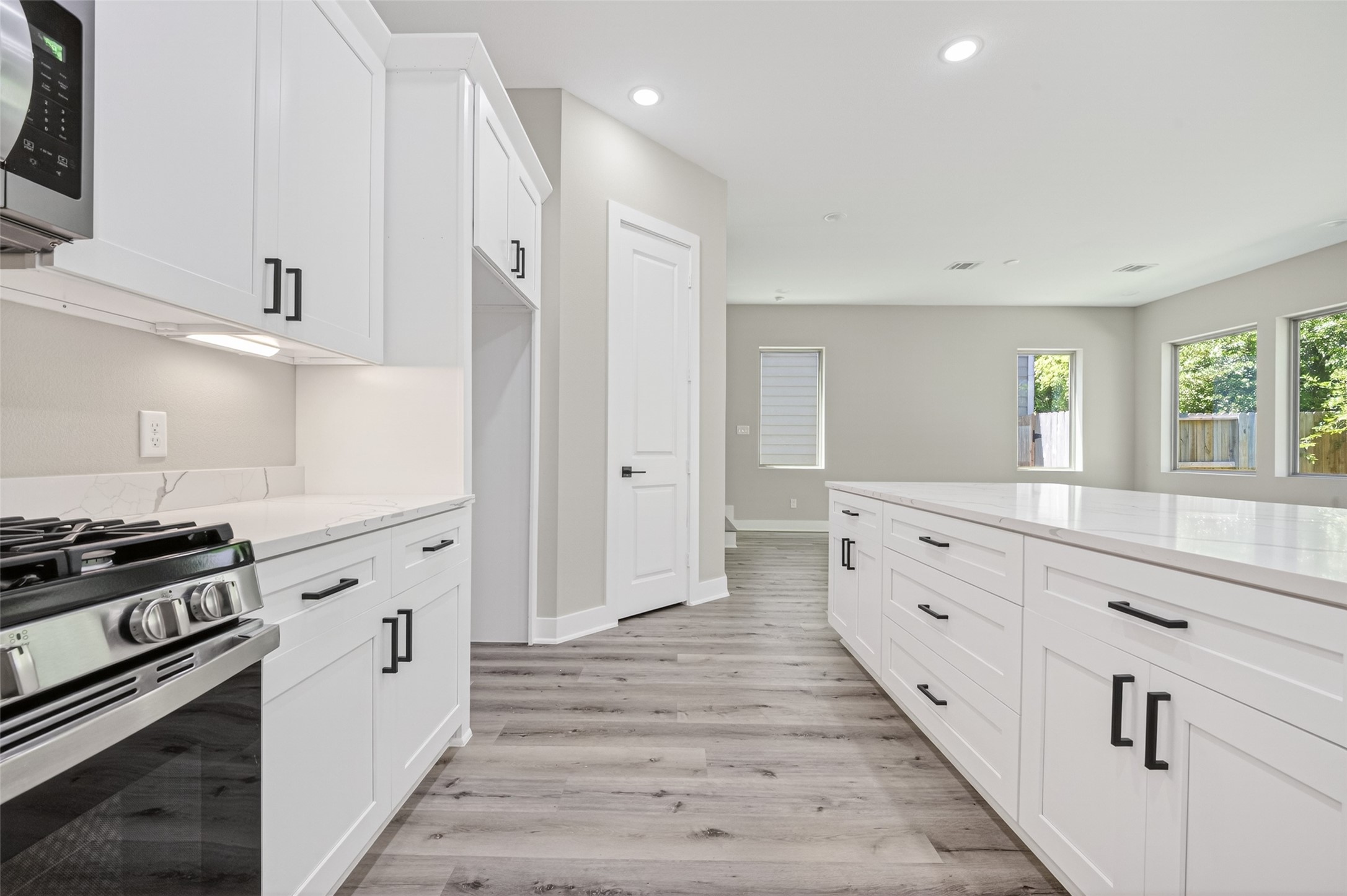4906 Wunder Way Houston, TX 77069 - Photo 13 of 44 a kitchen with granite countertop a stove and a sink