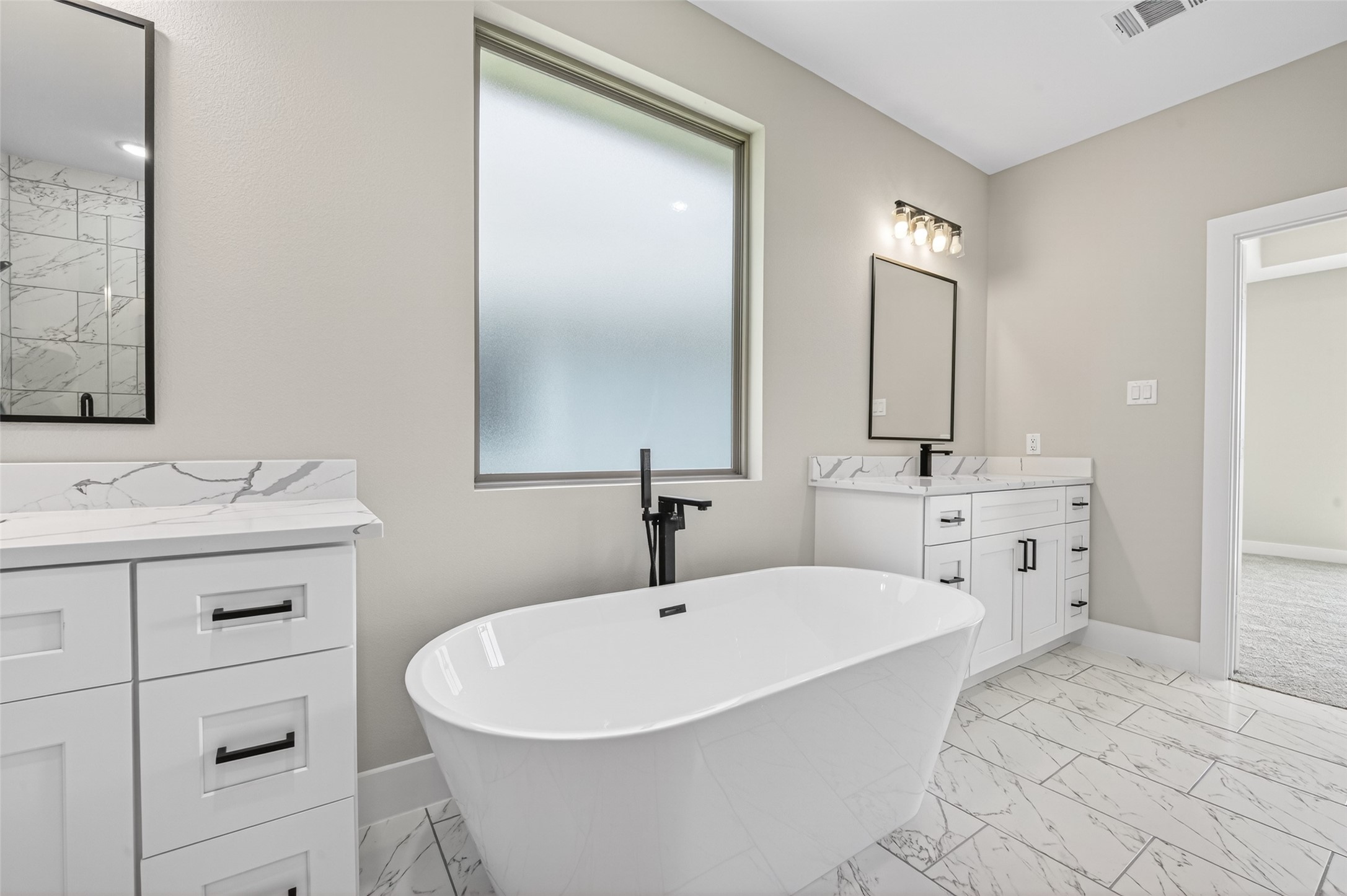 4906 Wunder Way Houston, TX 77069 - Photo 24 of 44 a bathroom with a sink and a mirror