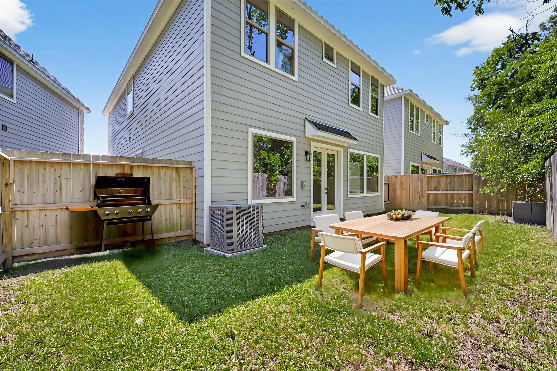 4906 Wunder Way Houston, TX 77069 - Photo 38 of 44 a backyard of a house with table and chairs