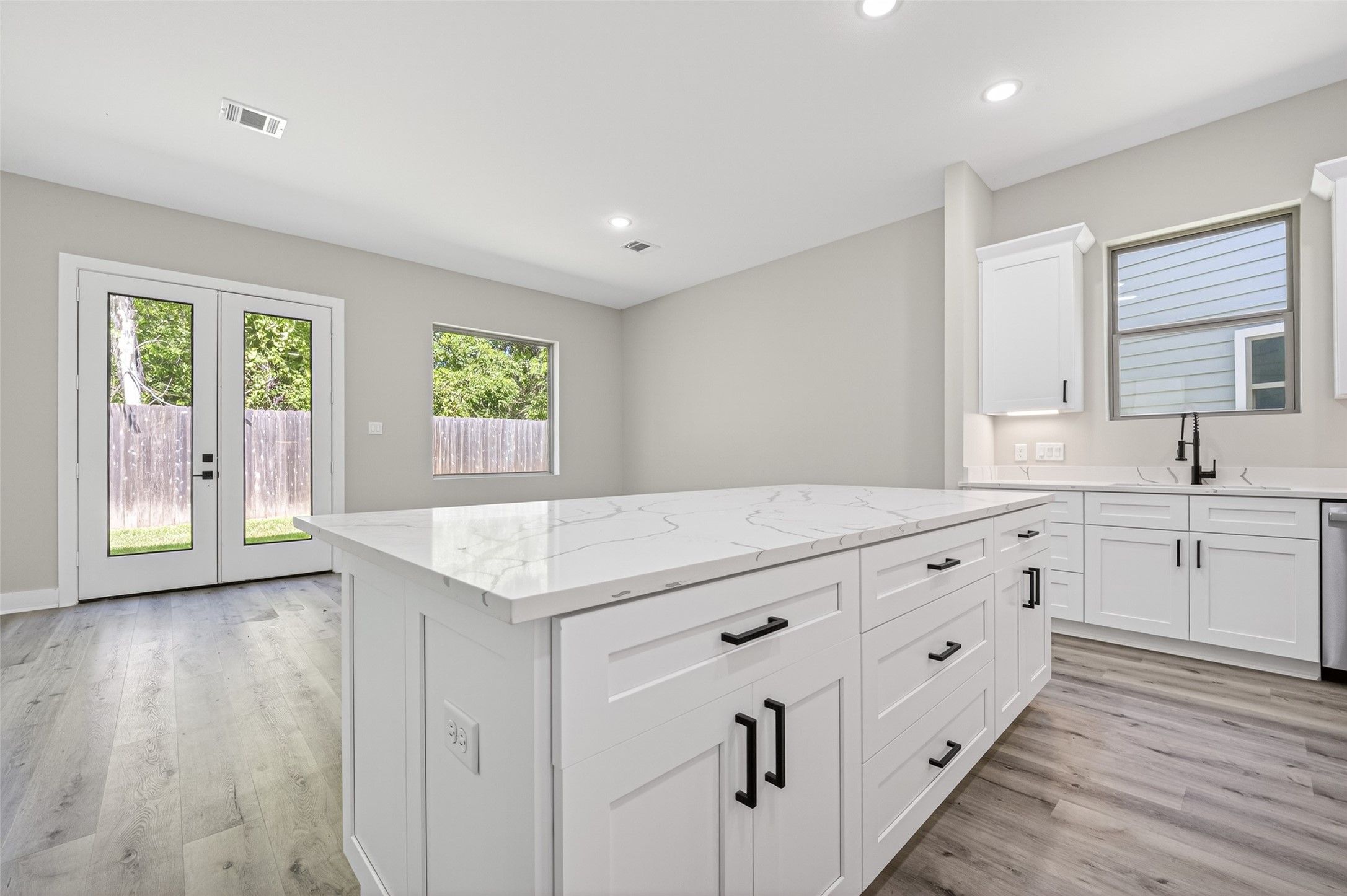 4906 Wunder Way Houston, TX 77069 - Photo 10 of 44 a kitchen with sink cabinets and window