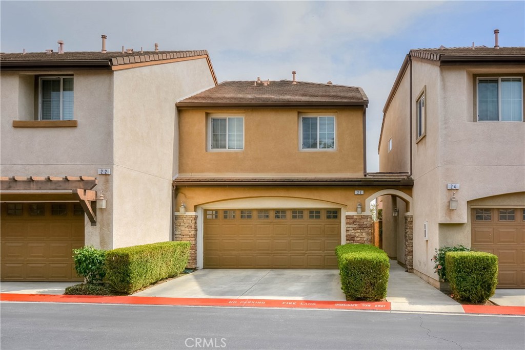8692 East 9th Street, Unit 23 Rancho Cucamonga, CA 91730 - Photo 1 of 1 a front view of a house with garden