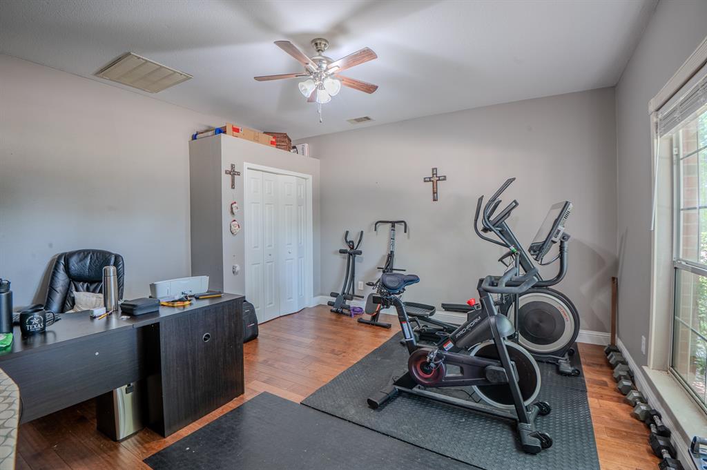 921 Carnegie Court Allen, TX 75002 - Photo 14 of 33 a view of a room with gym equipment