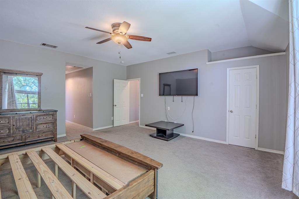 921 Carnegie Court Allen, TX 75002 - Photo 20 of 33 a living room with furniture and a flat screen tv