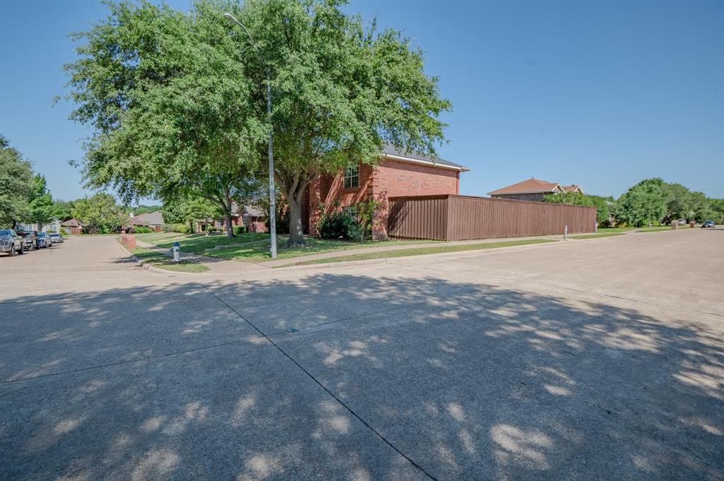 921 Carnegie Court Allen, TX 75002 - Photo 32 of 33 a house with a yard