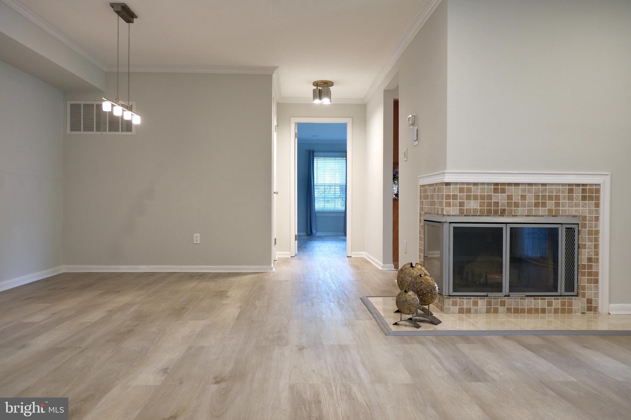 307 Trinity Court, Unit 4 Princeton, NJ 08540 - Photo 11 of 39 a view of a livingroom with wooden floor and a fireplace