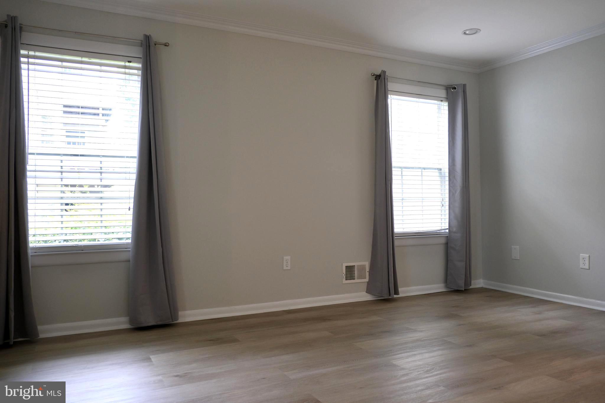 307 Trinity Court, Unit 4 Princeton, NJ 08540 - Photo 17 of 39 an empty room with wooden floor and windows