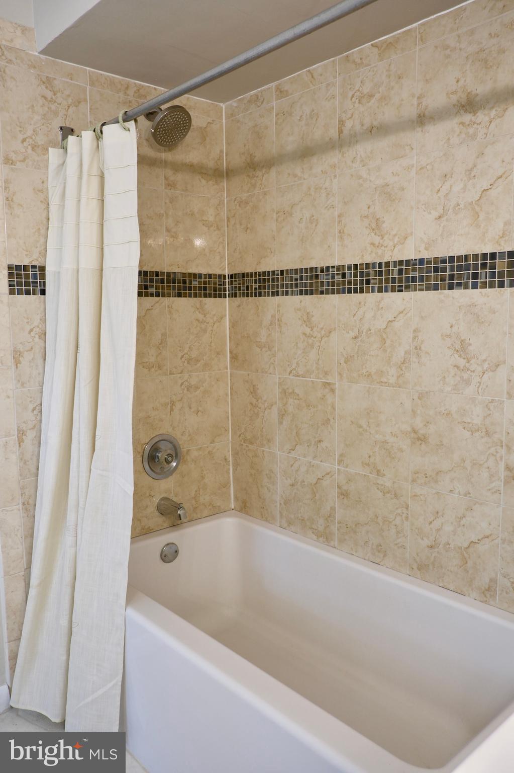 307 Trinity Court, Unit 4 Princeton, NJ 08540 - Photo 21 of 39 a bathroom with a shower and a bath tub