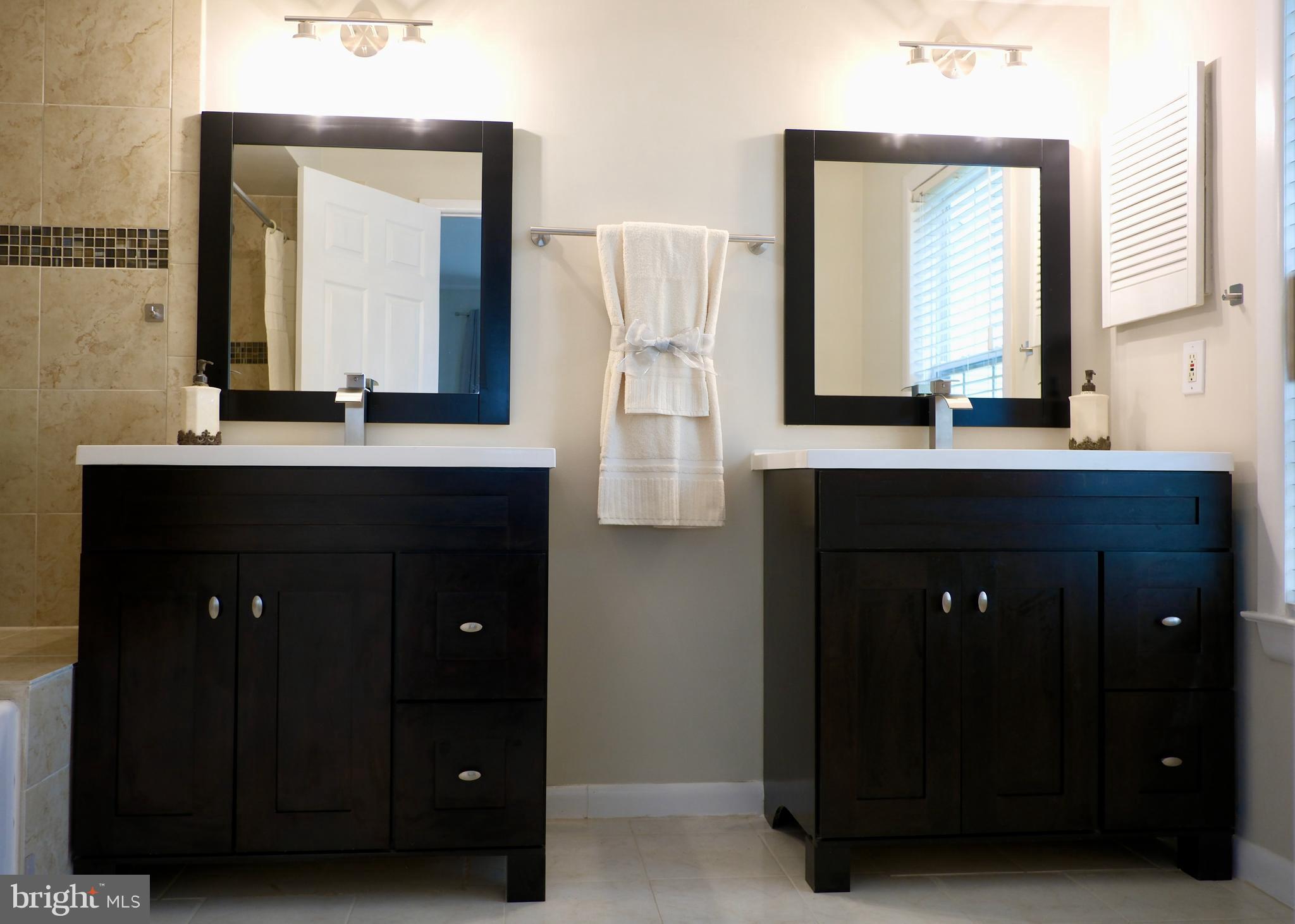 307 Trinity Court, Unit 4 Princeton, NJ 08540 - Photo 23 of 39 a bathroom with a sink vanity and a mirror