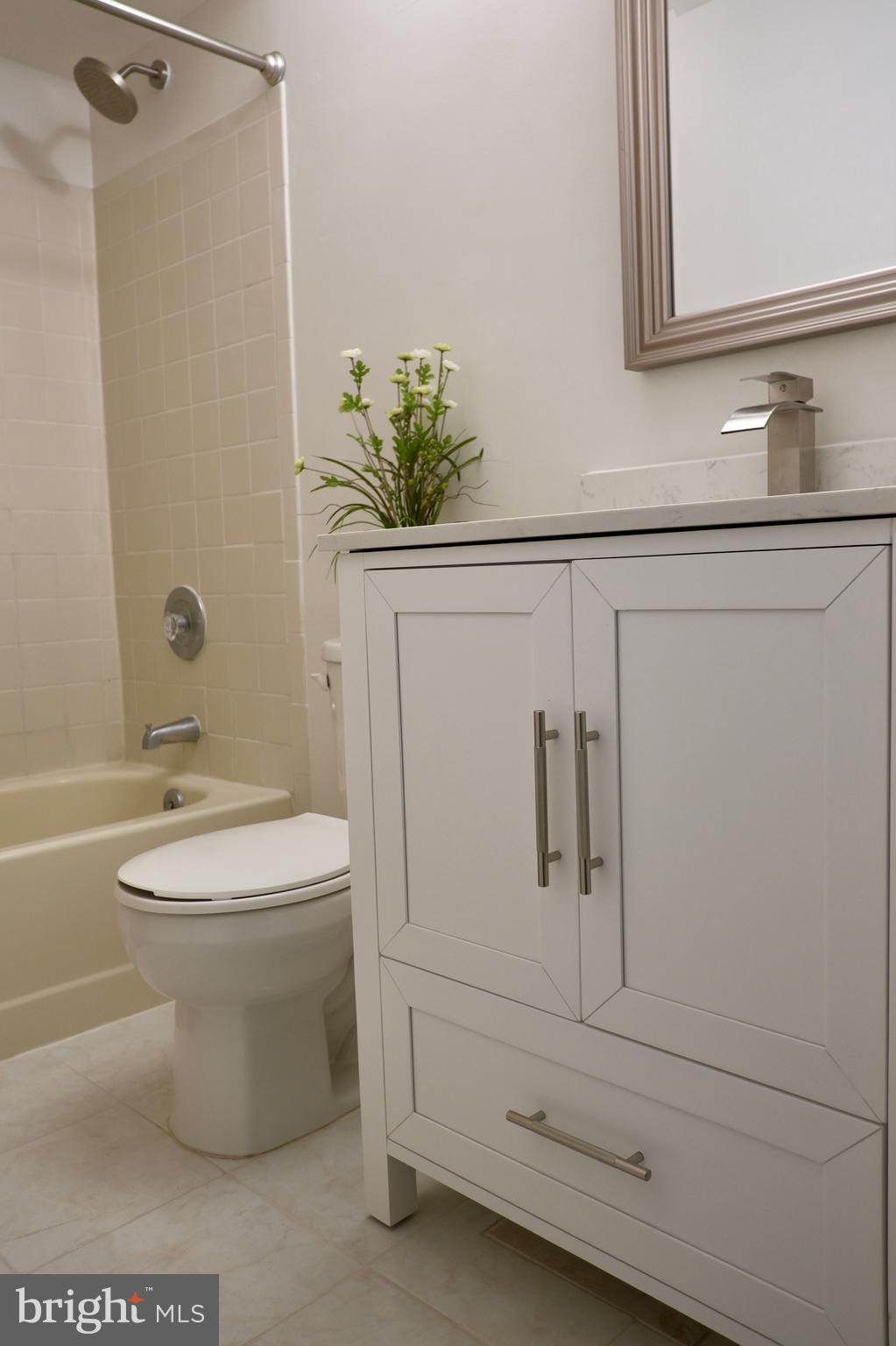 307 Trinity Court, Unit 4 Princeton, NJ 08540 - Photo 26 of 39 a bathroom with a toilet a sink and shower