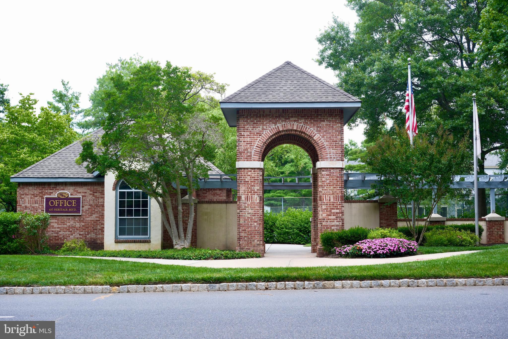 307 Trinity Court, Unit 4 Princeton, NJ 08540 - Photo 36 of 39 a front view of a house with a garden and plants