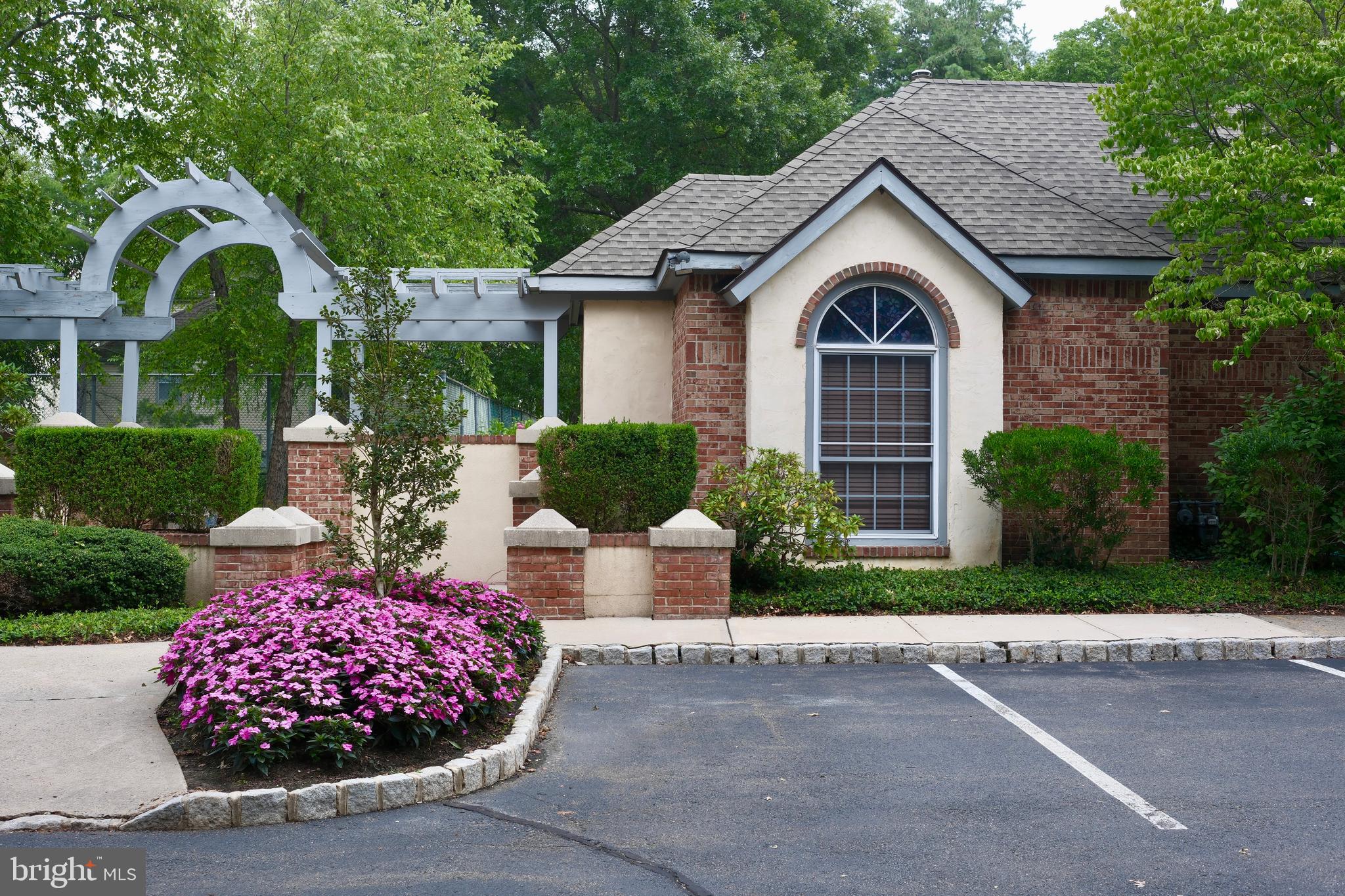 307 Trinity Court, Unit 4 Princeton, NJ 08540 - Photo 37 of 39 a front view of a house with a garden
