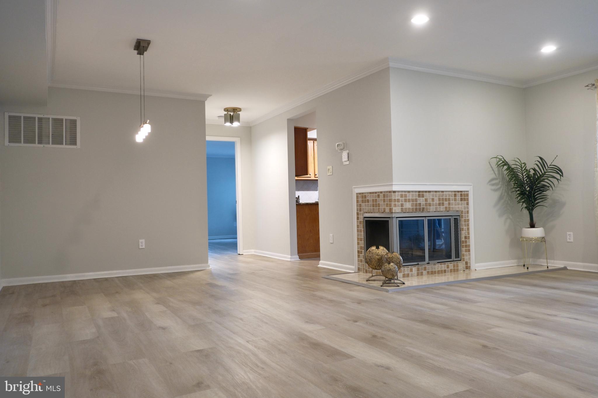 307 Trinity Court, Unit 4 Princeton, NJ 08540 - Photo 9 of 39 a view of a livingroom with a fireplace and window