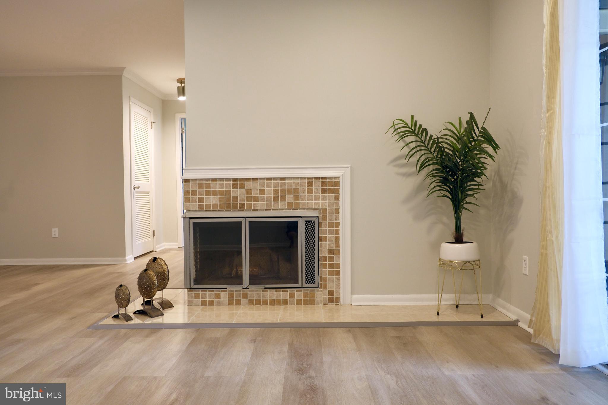 307 Trinity Court, Unit 4 Princeton, NJ 08540 - Photo 10 of 39 a view of a livingroom with a fireplace and window