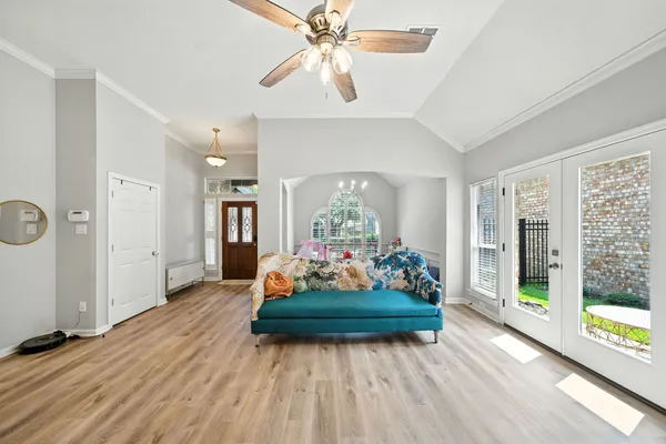 a living room with furniture and a large window