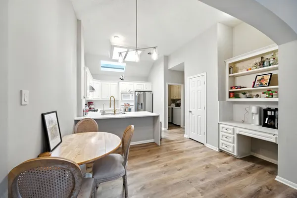 a dining room with furniture and window