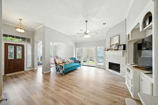 a living room with furniture fireplace and flat screen tv