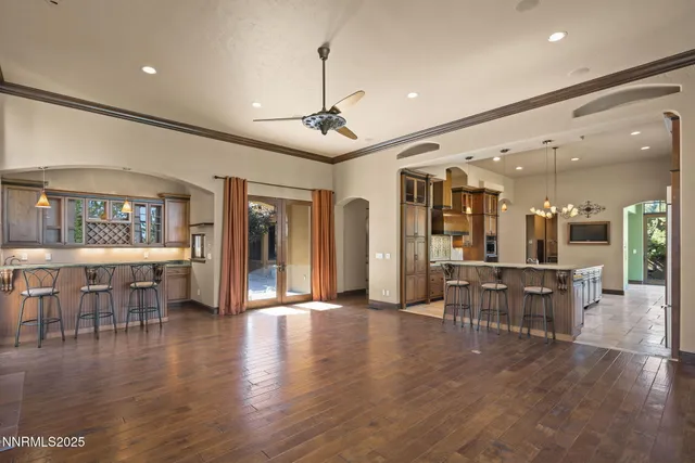 a large kitchen with stainless steel appliances granite countertop a stove and a sink