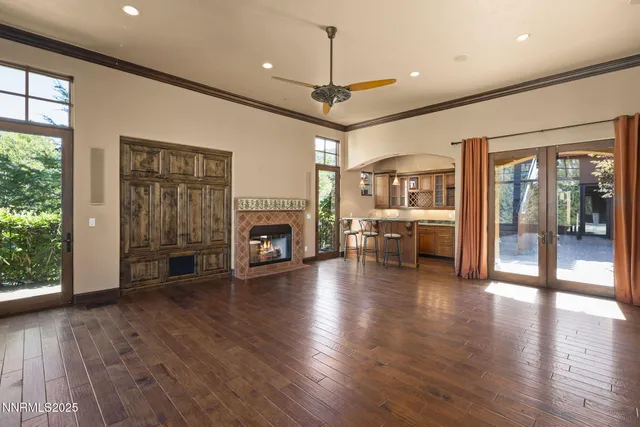 a kitchen with stainless steel appliances granite countertop a kitchen island a stove and a refrigerator