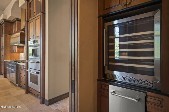 a spacious bathroom with a granite countertop sink mirror and shower
