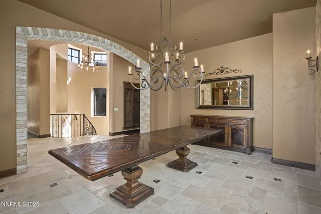 a kitchen with white cabinets and refrigerator