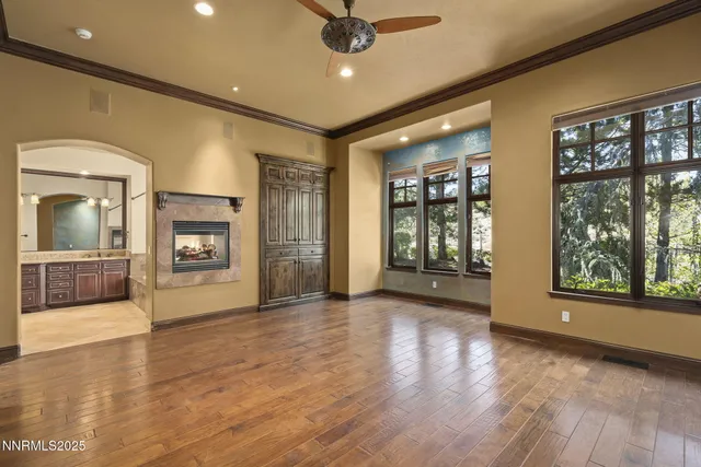 a kitchen with stainless steel appliances granite countertop a refrigerator a oven a sink with island and chairs