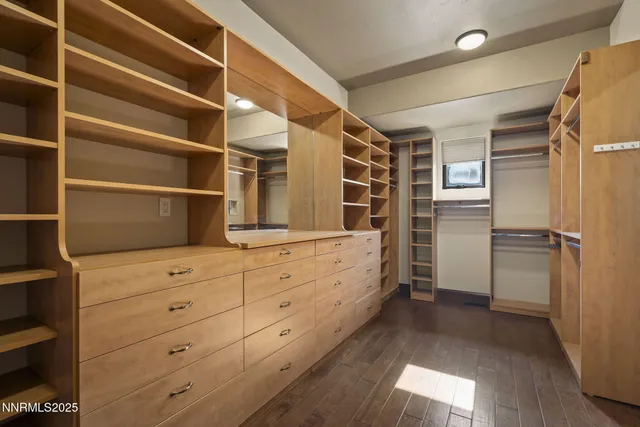 a bathroom with a granite countertop sink a toilet and shower