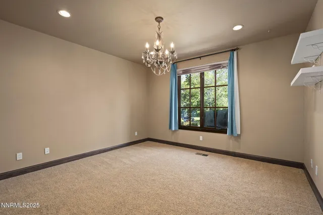 a kitchen with a sink and glass door