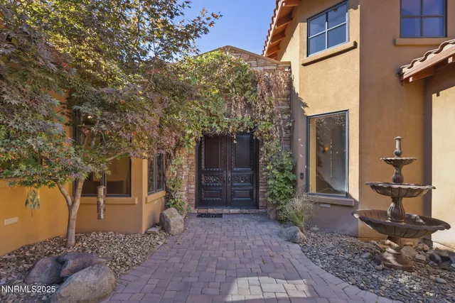 wooden floor fireplace and windows in an empty room
