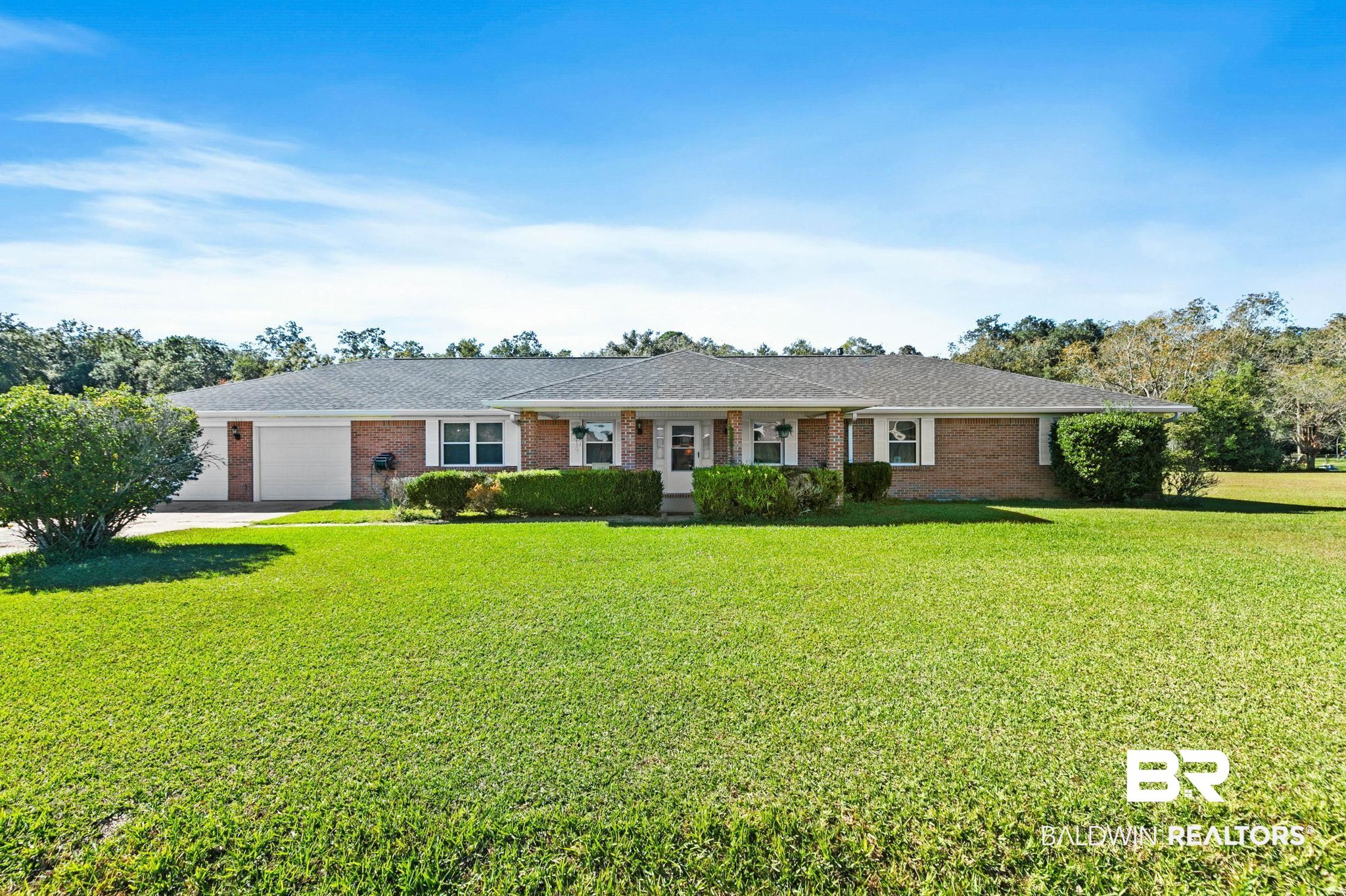 1510 South Juniper Street Foley, AL 36535 - Photo 5 of 36 Ranch-style house with a front lawn, brick siding, and an attached garage