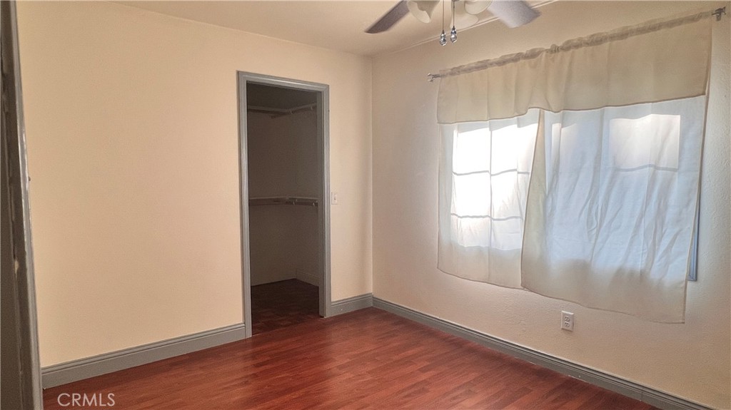 2135 Nord Avenue, Unit 33 Chico, CA 95926 - Photo 11 of 35 an empty room with wooden floor and windows