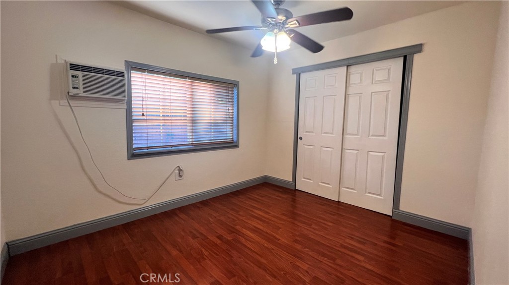 2135 Nord Avenue, Unit 33 Chico, CA 95926 - Photo 13 of 35 an empty room with wooden floor fan and windows