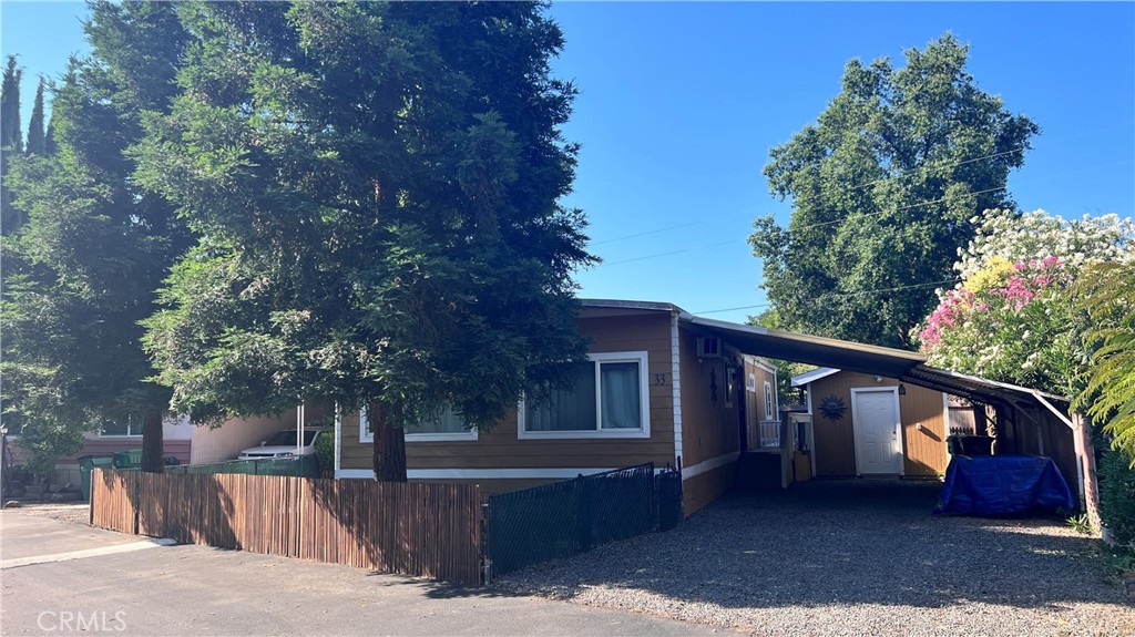 2135 Nord Avenue, Unit 33 Chico, CA 95926 - Photo 29 of 35 a front view of a house with a tree and a yard