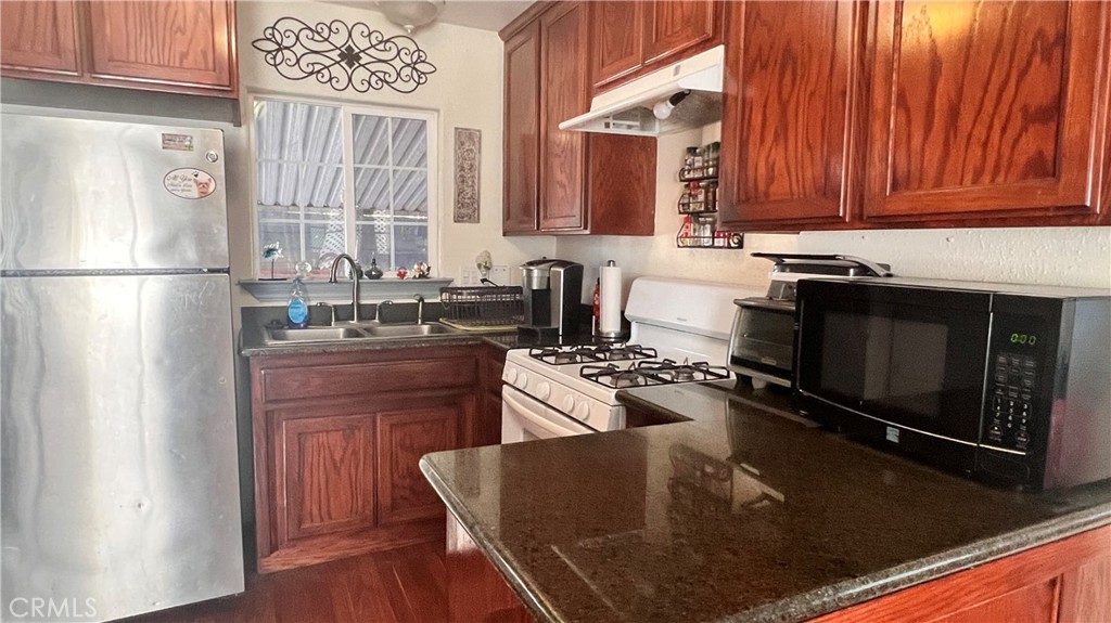 2135 Nord Avenue, Unit 33 Chico, CA 95926 - Photo 5 of 35 a kitchen with a refrigerator stove and sink